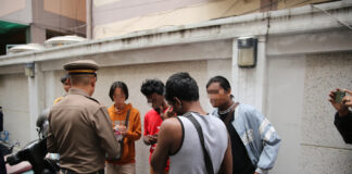 migrants contrôle Bangkok